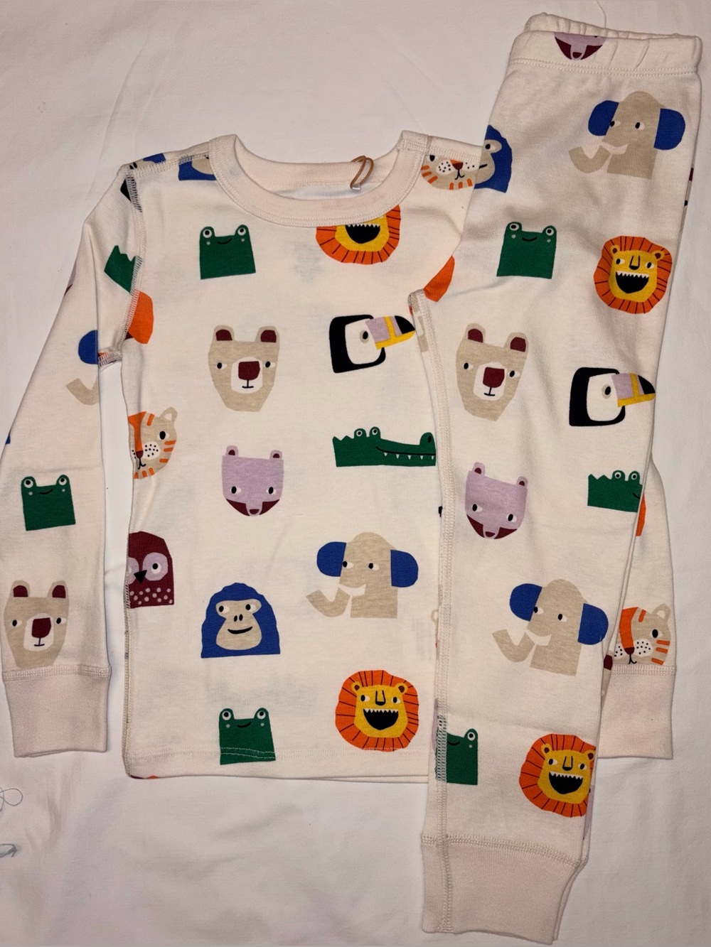 Quince kids unisex pajama set featuring a playful allover animal print sz 4T NWT